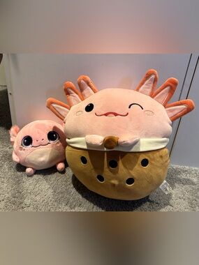 Two cute axolotl plushies